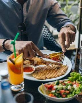 Chicken langet with potatoes on the table Stock Photos