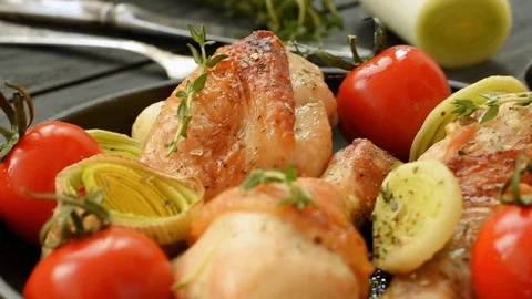 Chicken with leeks, cherry tomatoes, garlic and thyme Stock Footage 70061671