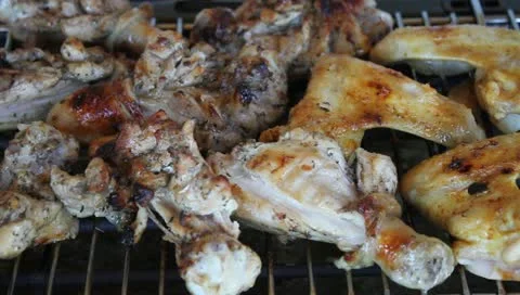 Chicken legs and wings on BBQ Video stock 11204853