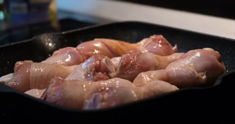 Chicken legs are fried in a grill pan. Chicken dish. The concept of recipes Stock Footage 166312116