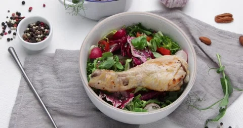 Chicken legs with fresh vegetables	 Stock Footage 169947556