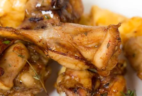 Chicken legs with melted cheese. Stock Photos
