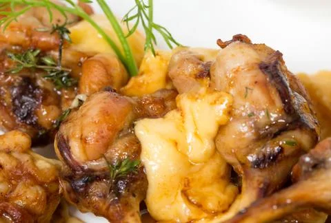 Chicken legs with melted cheese. 写真素材