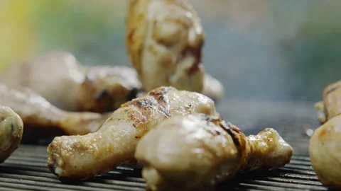 Chicken Legs Toasting on Barbeque Grid Close-up Stock-Footage 145252552