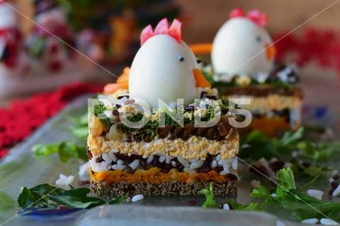 Chicken liver layered salad with chicken head Stock Photos