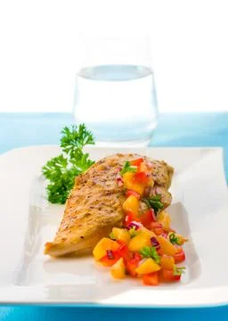 Chicken with mango salsa Stock Photos