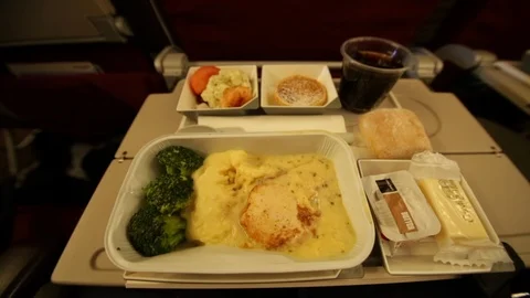 Chicken, mash potato and broccoli in flight meal Stock Footage 107656663