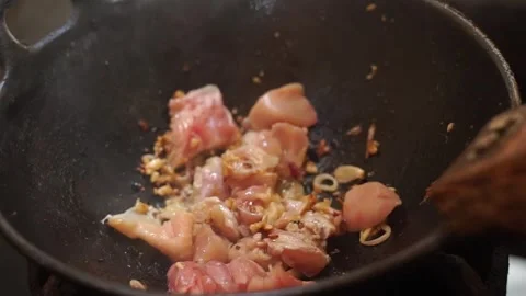 Chicken meat is being cooked to make chicken tongseng with salt Stock Footage 272297538