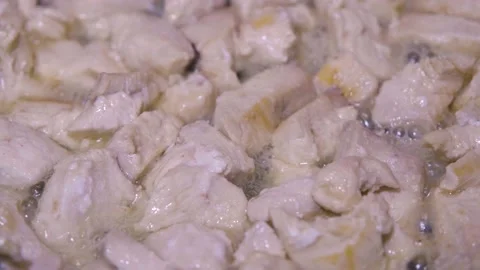Chicken meat is fried in a pan. Roasting chicken meat. home cooking Stock Footage 232809482