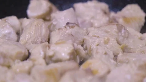 Chicken meat is fried in a pan. Roasting chicken meat. home cooking Stock Footage 232809539