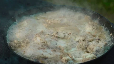 Chicken meat in a frying pan Video stock 64589347