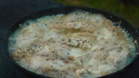 Chicken meat in a frying pan Video stock 64590859