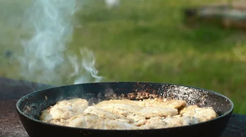 Chicken meat in a frying pan Video stock 64591890