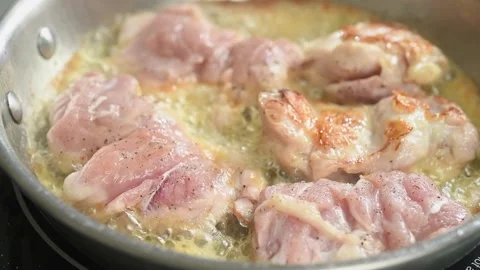 The chicken meat is frying in the pan. Stock Footage 210717823