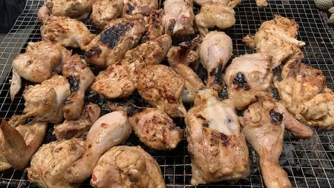 Chicken meat on the grill Stock Photos