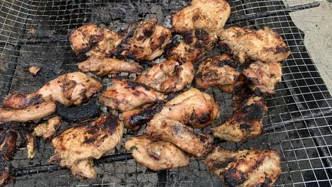 Chicken meat on the grill Stock Photos