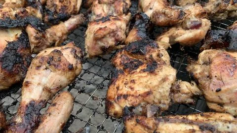 Chicken meat on the grill Stock Photos