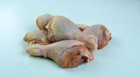 Chicken meat on a light background. selective focus. Stock Footage 230654763