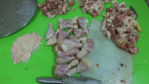 Chicken meat on the table. Preparation of chicken. Preparation of a bird. Stock Footage 83962338