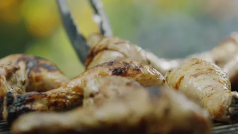 Chicken Meat Toasting on Barbeque Grid Close-up Stock Footage 145251197