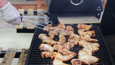 Chicken meat that turn over on a barbecue grill.Meat is fried in Mangal Barbecue Stock Footage