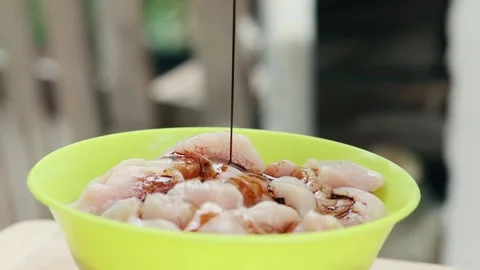 Chicken meat is watered with soy sauce close up Stock Footage 130769578