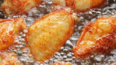 Chicken Mid Joint Wings are Fried in Boiling Oil Stock Footage 272284626
