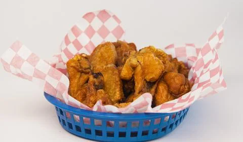 Chicken nuggets basket with checkered pattern paper on a white background Stock Photos
