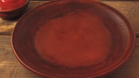 Chicken nuggets in breading fall into plate slow motion Stock Footage 79357301