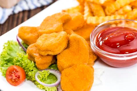 Chicken nuggets (with chips) Stock Photos