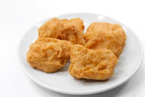 Chicken nuggets on white plate Stock Photos