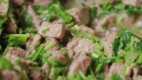 Chicken or pork stew with red and green pepper onion, and spices cooking in a Stock Footage 263085626