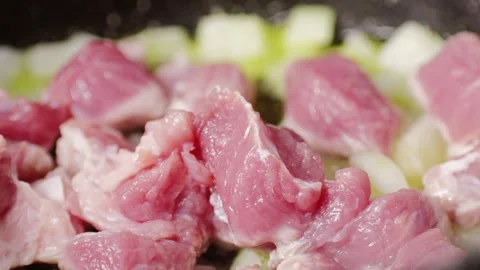 Chicken or pork stew with red and green pepper onion, and spices cooking in a Stock Footage 263086455