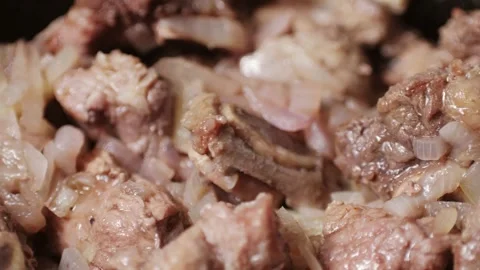 Chicken or pork stew with red and green pepper onion, and spices cooking in a Stock Footage 280189990