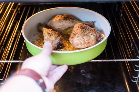 Chicken in a oven Stock Photos