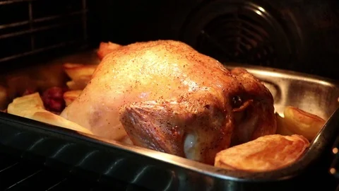 Chicken in the oven with potatoes Stock Footage 128496565