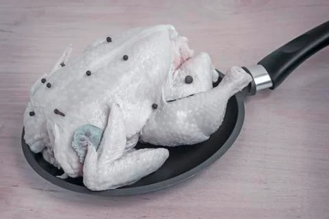 The chicken in the pan for frying. Stock Photos