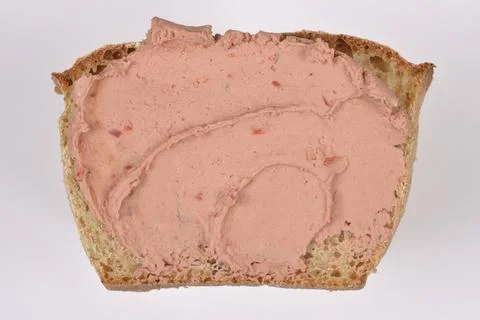 Chicken pate spread on a slice of rustic bread Stock Photos