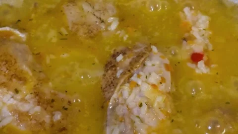 Chicken pilaf bubbling in pot close-up 스톡 동영상 317513276