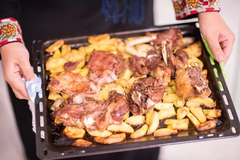 Chicken with potatoes closeup Stock Photos