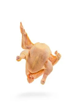Chicken, raw, walking, casting a shadow, wings spread. Raw chicken isolated on Stock Photos