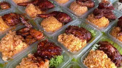 Chicken rice dish for take away on a Asian street food stall in Malaysia Stock Footage 206087344