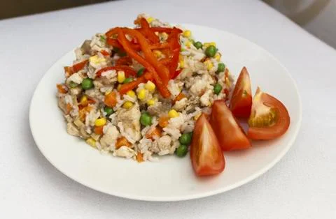 Chicken risotto on a plate white background Stock Photos