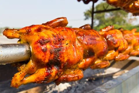 Chicken roasted on the spit Stock Photos