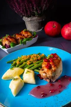Chicken roulades with polish dumplings (kopytka) and green beans Stock Photos