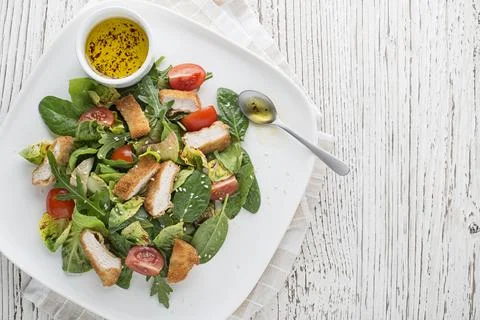 Chicken salad with crispy fried breaded chicken Stock Photos