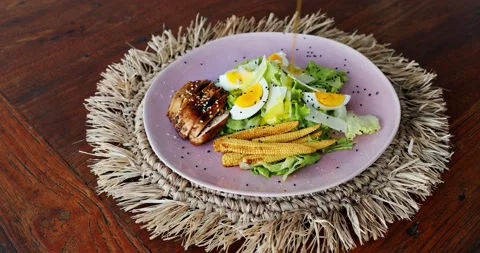 Chicken salad with fried young corn and egg dressed with olive oil Stock Footage 151733503