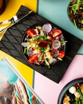 Chicken salad with vegetables on the table Stock Photos