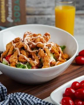 Chicken salad with vegetables on the table Stock Photos