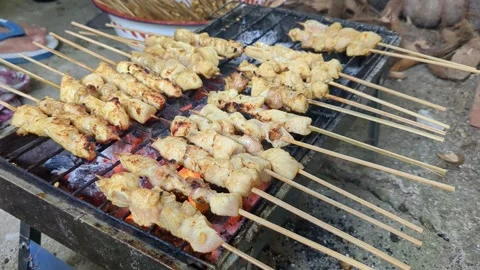 Chicken satay being grilled Stock Footage 337926495
